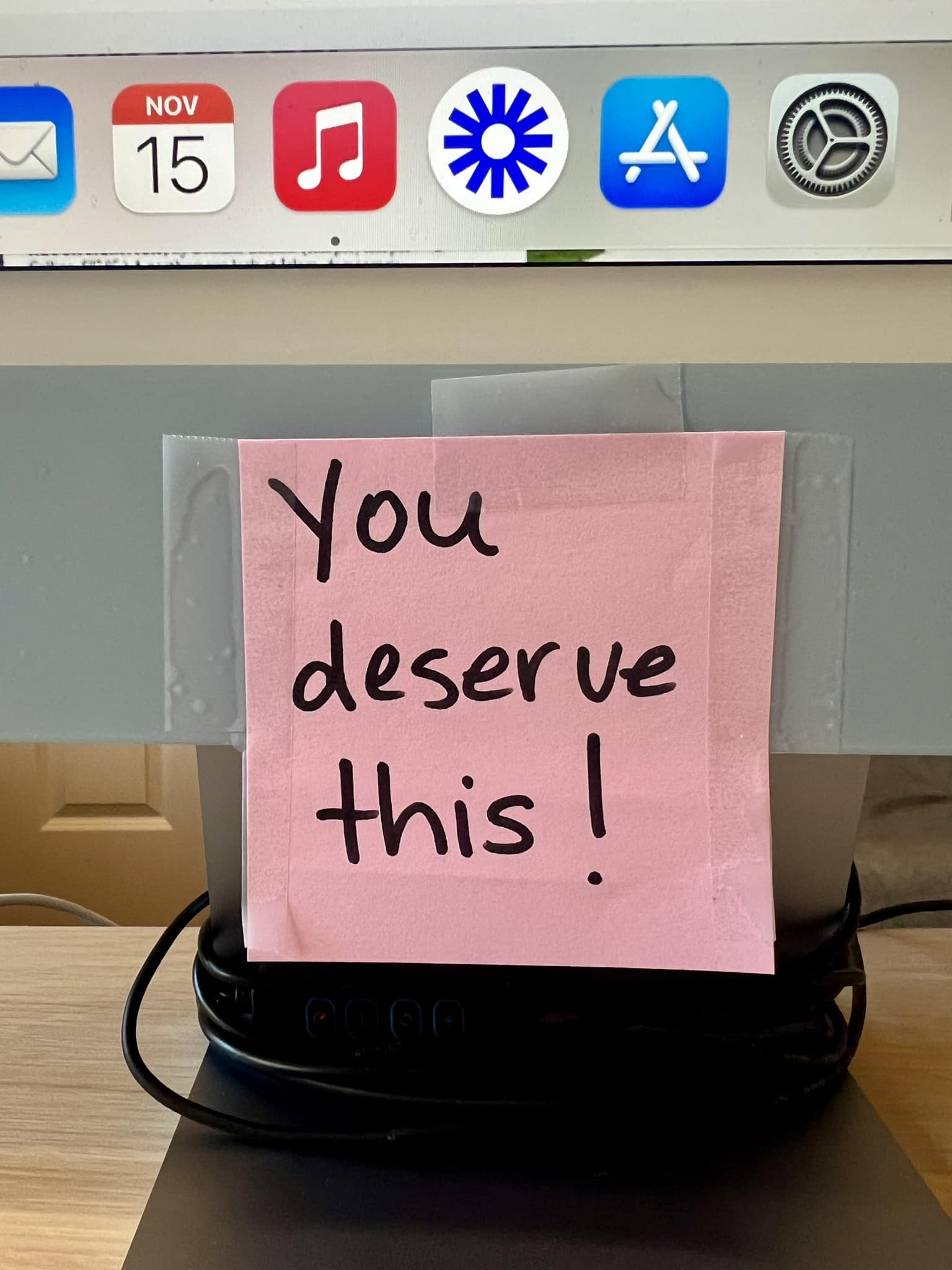 "You deserve this" written in a notepad.