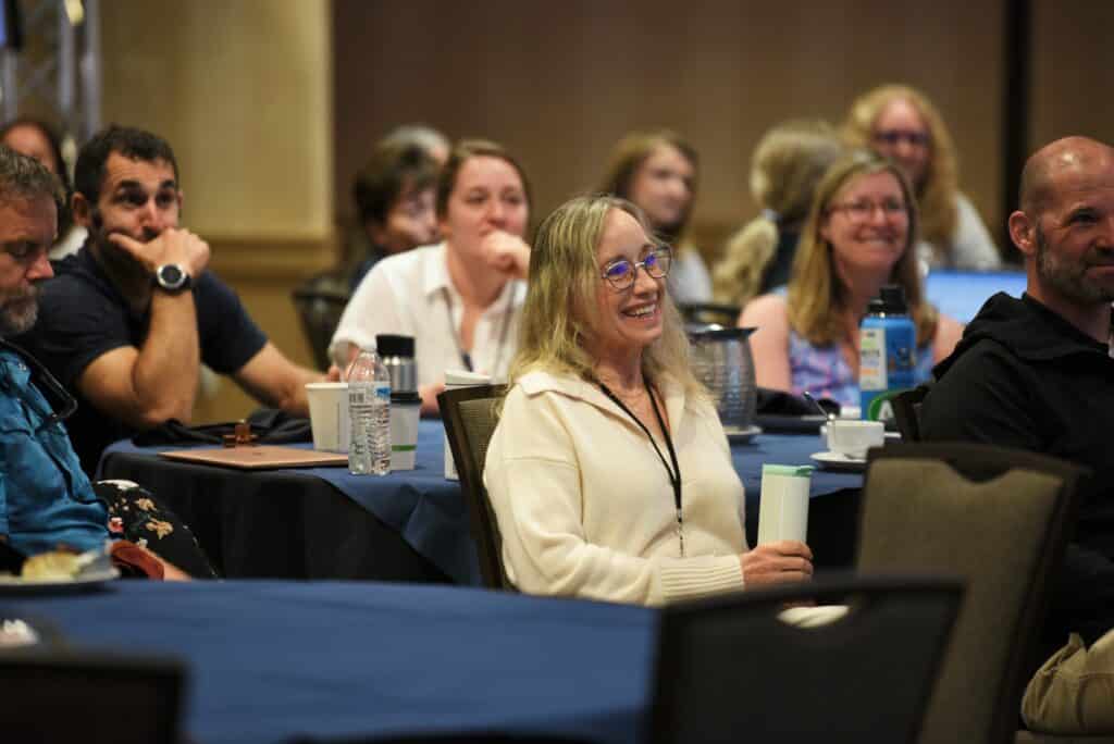 An engaged audience watching an impactful workshop at an education conference