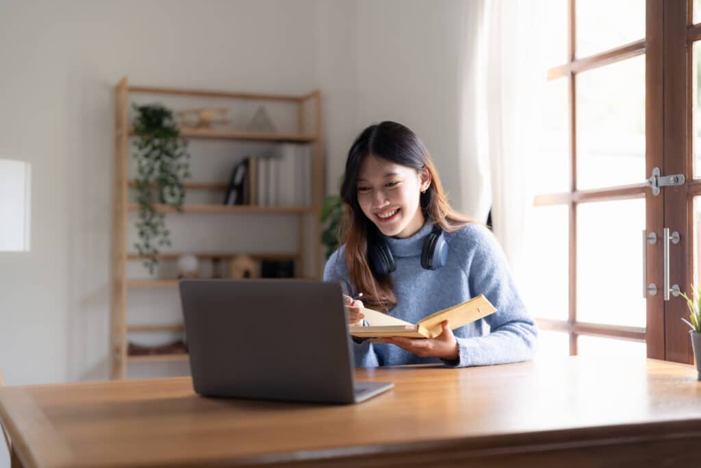Smiling teacher taking online course for professional development