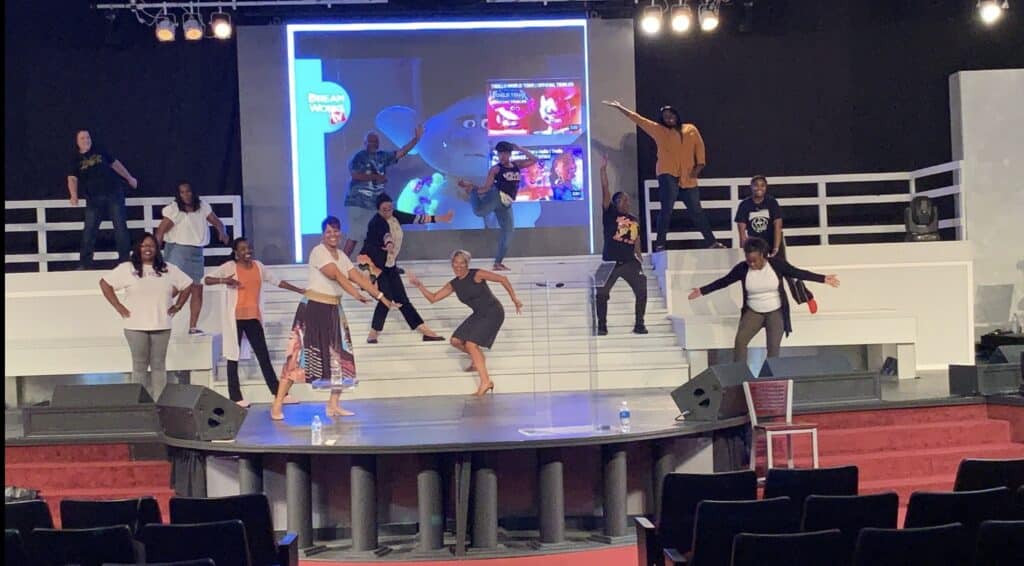 Kim Strobel on Stage showing high energy