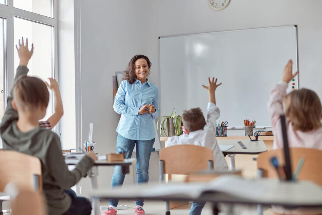 Young happy elementary school pupils professional development objectives concept