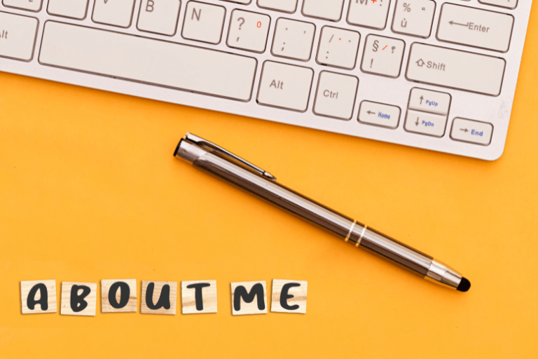 Keyboard and pen in a yellow background with letters forming "ABOUT ME"