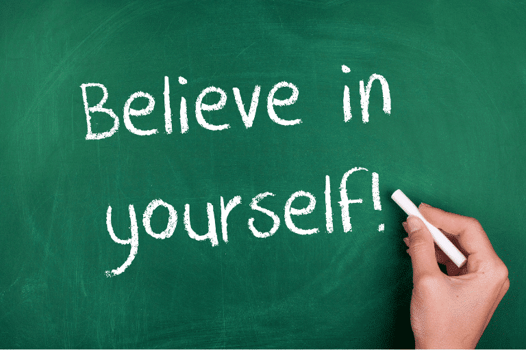 blackboard with written text believe in yourself