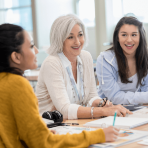 happy female teachers talking with each other