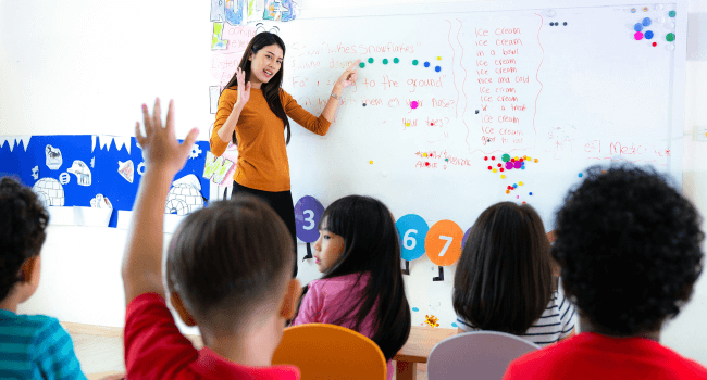 teacher pointing to the whiteboard