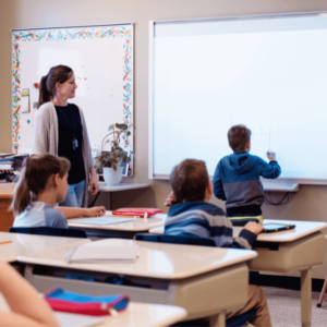 kid answering on whiteboard