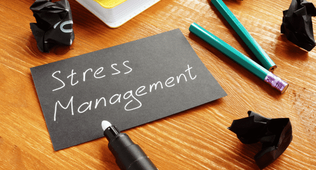 Stress management word in black paper