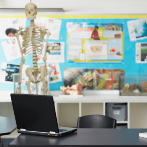 Laptop on top of the table inside the classroom