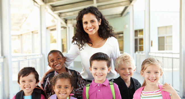 Happy Teacher together with her students