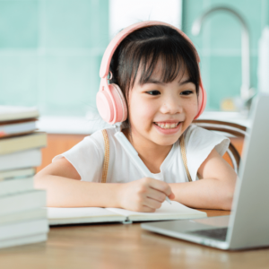 Student happily studying at home.