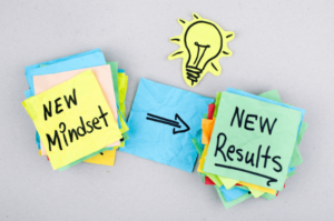 new mindset new results written on sticky notes