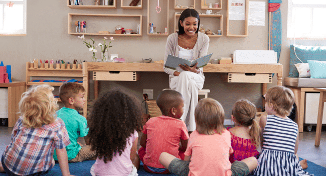 teacher reading in front of students