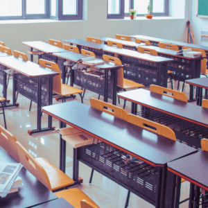 Desks arranged in a classroom.