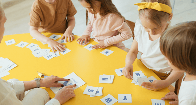 kids arranging letters